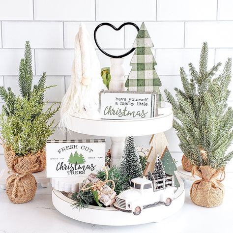 Simplify your holiday decorating with our deluxe farmhouse Christmas decor set! Each piece is perfectly coordinated and sized to fit your tiered tray, shelf, or any small vignette. Say goodbye to the frustration of mismatched decor and enjoy a beautifully styled space with ease. NOTE: The tiered tray and other items shown are for display purposes only and are NOT included in the decor set. Everything included is listed below. Sizes are approximate. Colors variations and styles may vary. The Merr Christmas Vignettes Farmhouse, Christmas Decorative Tray, Console Table Decorating For Christmas, Green Farmhouse Christmas Decor, Christmas Tier Tray Ideas, 2 Tier Christmas Tray Decor, Two Tier Tray Decor Christmas, Tiered Tray Christmas Decor, Christmas Bench Decor