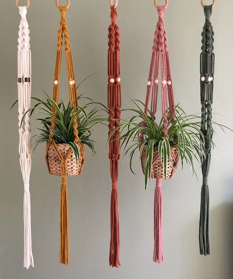 Boho Macrame Plant Hanger handmade from 100% recycled natural cotton and available in two sizes and a choice of five colours. Featuring intricate spiral knot details and lovely wooden beads.   SUSTAINABLE, NATURAL, AND HANDMADE WITH LOVE  All my macrame pieces are 100% plastic-free and made using natural, sustainable premium quality materials. Each plant hanger is carefully handmade to order in my studio in Ashbourne, Derbyshire. For every order made - I also plant a tree!  COLOURS: Available in Beaded Plant Hanger, Spiral Knot, Wall Mounted Planters, Macrame Plant Hanger Patterns, Hanging Terrarium, Macrame Hanger, Hanger Design, Macrame Patterns Tutorials, Boho Macrame