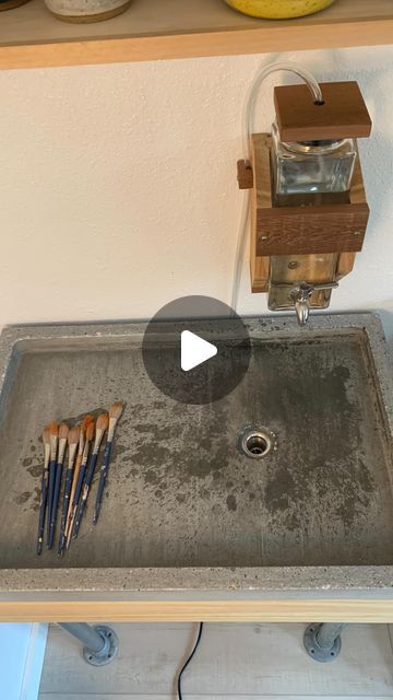 Erin Killian Pottery on Instagram: "We don’t have ground water to the studio but now we do have a sink! My husband designed the sink so the water flows through a leg down and under the studio. He cast the cement and rigged up the pump so I can wash paintbrushes, etc. I’ll still mostly use buckets but sometimes you just want fresh water. 😍 #studio #artstudio #ceramicstudio #oppositesattract #potterystudio #organized #timesaver #organizedspace #organized #organizeyourlife #organizedliving #potterytools #sink #clean" Clay Sinks, Industrial Sink, Hand Pottery, Attic Studio, Ground Water, Ceramics Studio, Boarding House, Diy Ceramic, Organized Living