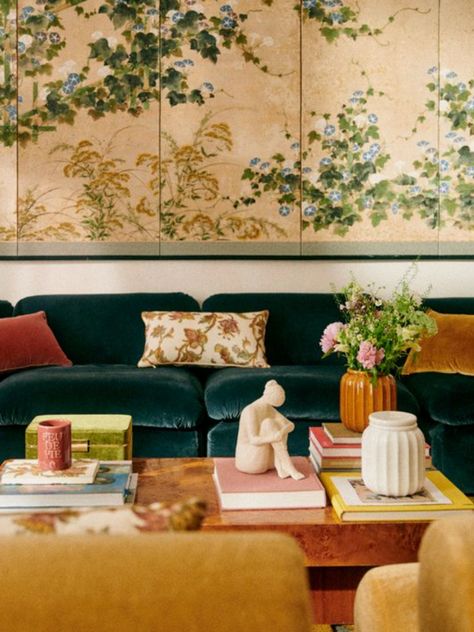 Dainty Interior Design, Green Couch Green Wall, Vintage Floral Interior Design, Sezane Apartment, Floral Couch Aesthetic, Green Anthropologie Couch, Couch Floral Installation, Floral Interior Design, Floral Tapestry Sofa