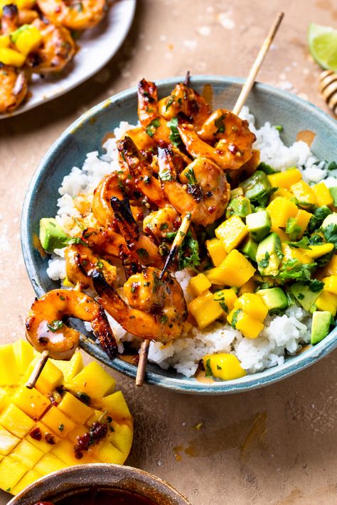 Shrimp skewers in a bowl with avocado mango salsa over rice Shrimp Bowls With Mango Salsa, Honey Chipotle Shrimp Bowl, Mango Salsa Shrimp Bowl, Grilled Shrimp Bowl, Honey Butter Shrimp, Coconut Rice And Mango, Protein Rice, Shrimp Bowl, Honey Garlic Shrimp