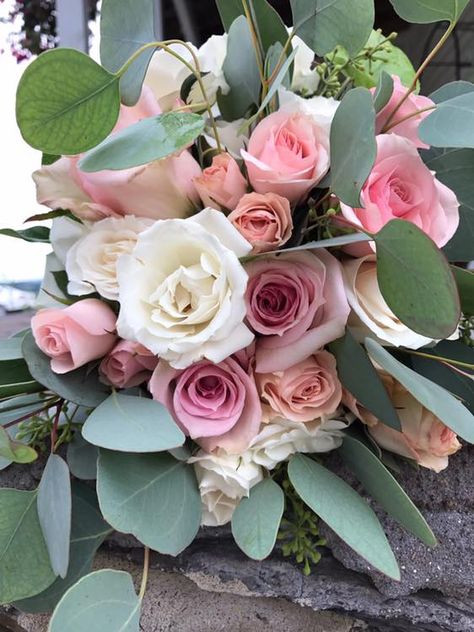 Clutch bouquet of blush pink peach and white roses and spray roses with silver dollar eucalyptus Clutch Bouquet, Dollar Eucalyptus, Silver Dollar Eucalyptus, Pink Bouquet, Spray Roses, Pink Peach, Silver Dollar, White Roses, Bridal Bouquet