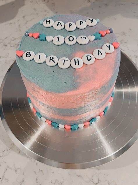 New eras birthday cake featuring bracelet lover theme Diy Taylor Swift Cake, Lover Cake Taylor Swift, Taylor Swift Birthday Cake Ideas, Taylor Swift Themed Cake, Eras Tour Cake, Taylor Swift Cake Ideas, Eras Cake, Taylor Swift Birthday Cake, Healthy Baking Alternatives