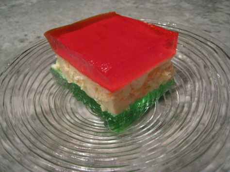 This red, white, and green jello is a classic addition to the holiday table (you can switch colors for other occasions). Recipe from Celebrating 100 years of Jello. I speed-up the chilling time table by setting each bowl/pan over a larger bowl/pan of ice water (lots of ice). I do this with all my Jello and each stage is done in about 15-20 minutes. You need to check for required texture and not go by clock. I love making these layered desserts! Ribbon Jello, Jello Pudding Desserts, Ribbon Salad, Jello Gelatin, Jello Recipe, Green Jello, Lemon Jello, Jello Desserts, Jello Salad