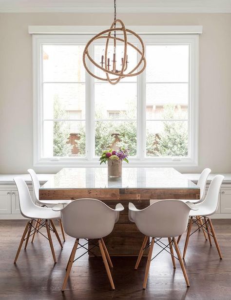 Contemporary dining room features a rope sphere chandelier hanging over a square wood dining table with glass top lined with Eames Molded Plastic Armchairs. Country Kitchen Tables, Chic Dining Room, Coastal Dining, Dining Room Contemporary, Contemporary Dining Room, Square Dining Tables, Square Table, Decor Minimalist, Farmhouse Dining