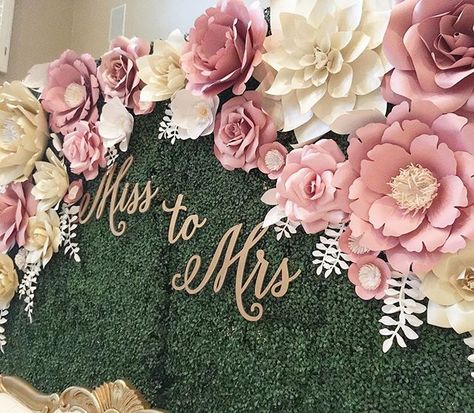 Here's a close up picture of the beautiful paper flower backdrop I installed this past weekend. For those of you who asked, the backdrop is a faux boxwood hedge wall rented from a local rental company. Since the hedge wall had grids (you can see it up close) on them I used "S" shaped metal hooks that I made using thick green floral wire to hang the flowers on the wall. . . . . #paperflower #paperart #paperartist #papercraft #handmade #silhouette #silhouettecameo #paperflowers #papercraftin... Miss To Mrs, Paper Flowers Wedding, Paper Flower Backdrop, Giant Paper Flowers, Beautiful Paper, Flower Backdrop, Wedding Backdrop, Shower Decorations, Diy Flowers