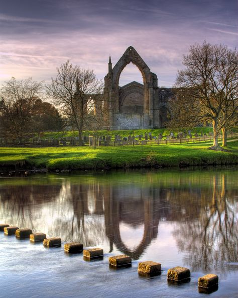 The beautiful Bolton Abbey priory and stepping stones. #cavendishpavilion #boltonabbey #yorkshire #northyorkshire #yorkshiredales #beauty #river #steppingstones #travel #pictureperfect #scenery #views #mirroring #greenery #scenic #symmetry #landscape Photo credit: Chris Northall Bolton Abbey, Uk Trip, Invisible Cities, Scenic Photography, Family Days Out, Yorkshire Dales, English Countryside, Yorkshire England, British Isles