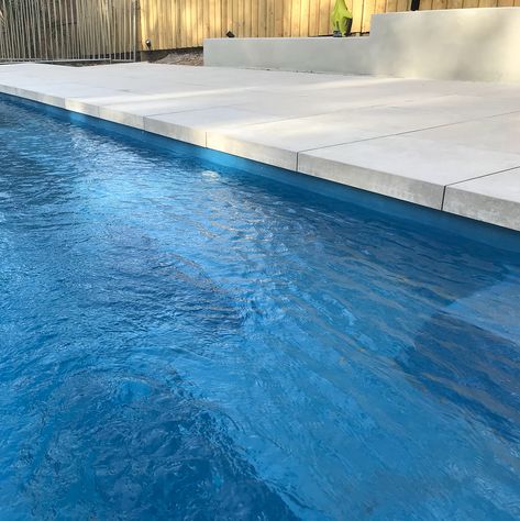 Dropdown /dropface pool coping using porcelain pavers. #narellanpools #dropfacecoping #porcelaintiles #ambertilesseaforth @ 📷wollimbi_landscapes_sydney Pool Deck Tile, Stone Pool Deck, Fibreglass Pool, Waterline Pool Tile, Awesome Pools, Pool Gardens, Pool Surround, House Finishes, Pool Paving