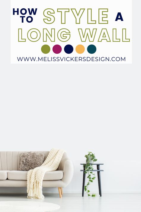 Large white empty wall with a neutral sofa in front.  Sofa has a knit throw blanket and taupe fuzzy pillow.  There is a black side table with a simple plant on it. How To Style A Long Living Room Wall, Ideas For Long Walls Living Rooms, Pictures Behind Couch Ideas, How To Decorate Long Wall Living Rooms, How To Break Up A Long Wall Living Room, How To Style A Long Wall, Long Wall Ideas Living Room, Decorate A Long Wall In Living Room, Long Wall Decorating Ideas Living Room Open Concept