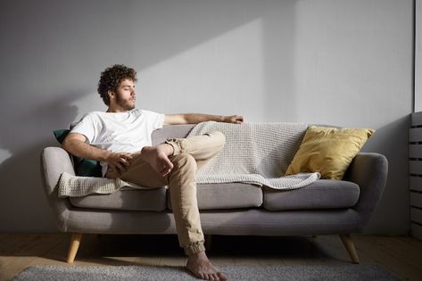 Men With Stubble, Red Checkered Shirt, Mens Photoshoot Poses, Cozy Couch, Man Photography, Men Photography, Sitting Poses, Man Sitting, Mens Loungewear