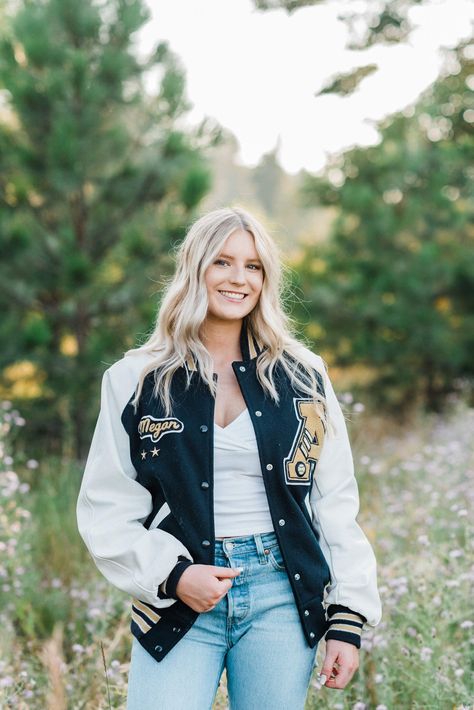 Softball Field Senior Pictures, Leatherman Jacket Senior Pictures, Senior Picture Cross Country, Senior Photos Letterman Jacket, Senior Picture Letterman Jacket, Senior Pics Sports, Sporty Senior Picture Ideas, Softball Senior Pictures Poses, Senior Pictures Letterman Jacket