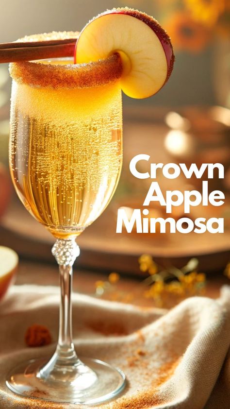 This Crown Apple Mimosa combines the crisp taste of apple with the bubbly joy of sparkling wine. #CrownAppleMimosa #Apple Fall Drink Ideas Alcohol, Apple Mimosa, Fruity Rum Drinks, Fancy Crown, Crown Royal Apple, Cheap Champagne, Crown Apple, Royal Recipe, Apple Whiskey