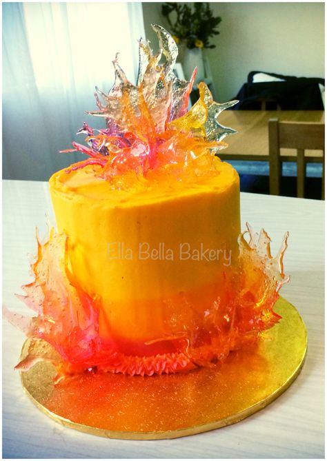 Flame cake by Ella Bella Bakery - www.facebook.com/ellabellabakery Chocolate and vanilla cake, layered with white chocolate ganache and honeycomb pieces, finisheed with ombre honeycomb buttercream. Garnished with pulled sugar flames. #fire #flame #cake Fire Cakes Ideas, Flame Birthday Cake, Fire Themed Cake, Charizard Party, Fire Cake Ideas, Flame Cupcakes, Fire Birthday Cake, Phoenix Cake, Flame Cake