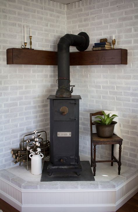 Brick Wood Stove Hearth, Pellet Stove Ideas Corner, Stove Makeover, Hearth Makeover, Corner Hearth, Pellet Stove Hearth, Wood Stove Decor, Wood Burning Stove Corner, Corner Wood Stove