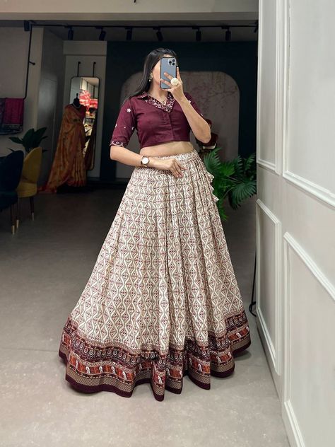 MRD 1223 SINGLES AVAILABLE *Lehenga(Stitched)* Lehenga Fabric : Rayon Cotton Lehenga Work : Patola With Foil Print Waist : Supported up to 42 Stitching : Stitched With Canvas Lehenga closer : Drawstring with tassels Length : 41 Flair : 3.60 Meter Inner : Micro Cotton *Blouse (Stitched)* Blouse Fabric : Pure Cotton Blouse Work : Plain And Handwork With Mirror Work Blouse Size : 38” There Is Margin Customer Can Adjust Upto 44 Blouse Length : 15 Sleeve Length : 12 *Package Contain : Leheng... Lehnga Choli Designer Party Wear, Skirt And Top Indian, New Model Dress, Lengha Blouse Designs, Mirror Work Dress, Diwali 2024, Print Lehenga, Haldi Outfits, Lehenga Saree Design