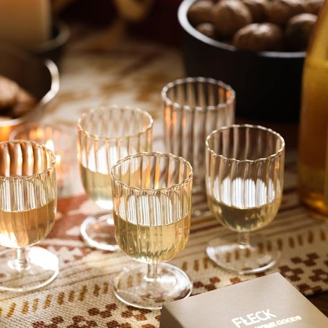 Entertain this summer with our beautifully crafted glassware made with traditional glass blowing techniques and featuring a delicate fluted design . Made with safe and environmentally-friendly borosilicate glass. #glassware #glassblowingart #borosilicateglass #cocktailparty #dinnerparty #summerevents #brunchideas #tablesetting #tabledecor