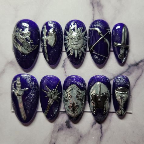 Set of hand-painted, medium almond shaped press-on nails with a medieval knight themed design. Comes with 1 sheet of nail adhesive tabs (24 pcs). -If you wish to purchase this design in a different shape or length, please message me prior to purchasing so I can accommodate your preference. Please do not order sets of 10 if you are not confident in what your nail sizes are, as I do not want you to receive nails that do not fit properly Midevil Nail Art, Royalcore Nails, Nail Art Themes, Medieval Nail Art, Greek Mythology Nails, Dark Fairy Nails, Lotr Nails, Medieval Nails, Protection Nails