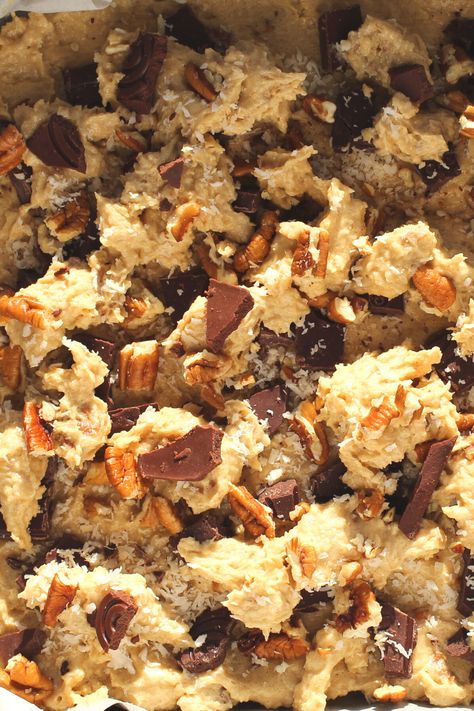 These Keto Cowboy Cookie Bars is an adaptation of a 5/5 star NY Times recipe. These easy low-carb cowboy cookies which have been made into bars taste as they came from a fancy bakery! They are thick and chewy and full of nutty goodness!   Simply combining coconut, pecans, cinnamon and chocolate, these cookie bars make the most flavourful gluten-free and sugar-free keto cookie bars! Low Carb Cowboy Cookies, Keto Cowboy Cookies Recipe, Keto Cowboy Cookies, Keto Bar Cookies, Cowboy Cookie Recipe, Low Carb Protein Bars, Keto Bars, Pea Protein Powder, Cowboy Cookies