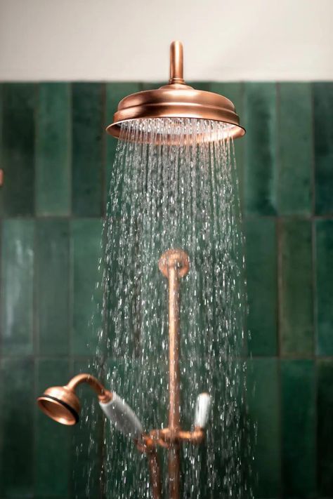 Copper In Interior Design, Bathroom With Copper Accents, Bathroom Copper Accents, Copper Home Accents, Green And Copper Bathroom, Copper Interior Design, Copper Faucet Bathroom, Copper Decor Accents, Metallic Bathroom