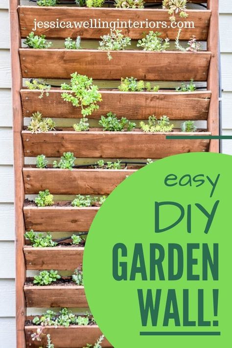 Build this simple outdoor DIY garden wall planter for your succulents of herbs! Hanging Garden Ideas Diy Projects, Outside Garden Wall Ideas, Diy Herb Wall Indoor, Wooden Vertical Garden, Diy Outdoor Plant Wall, How To Build A Plant Wall, Herb Fence Garden, Succulent Outdoor Wall, How To Build A Vertical Garden Wall