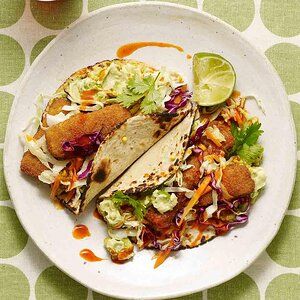 Fish Tacos with Avocado-Lime Crema Recipe | EatingWell Fish Taco Crema Recipe, Recipe For Fish Tacos, Recipe For Fish, Battered Fish Tacos, Crema Recipe, Beer Battered Fish, Avocado Crema, Beer Battered, Battered Fish