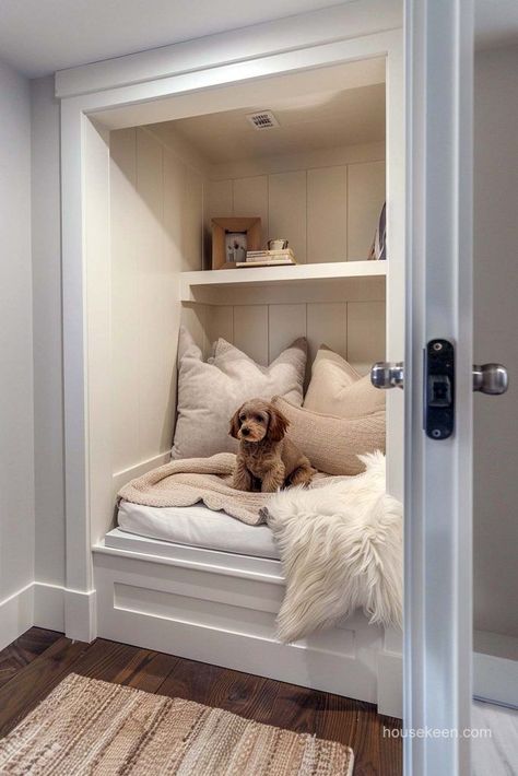 In the heart of this expansive closet resides an internal chamber fitted with custom integrations to give your dog their own sleeping and lounging quarters. Dog Bed Under Kitchen Island, Aesthetic Dog House Indoor, House For Dogs Ideas, Custom Dog Room, Dog Room Ideas Bedrooms Pet Beds, Built In Dog House In Wall, Dog Rooms In House Bedrooms, Closet Dog Room Ideas, Cute Dog Area In House