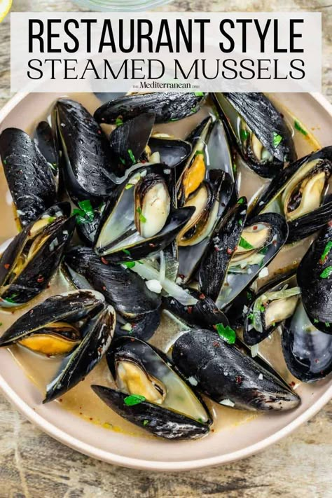 Tender steamed mussels in a white wine broth is an easy and irresistible recipe! Get all the tips for how to buy, clean, and cook mussels. Muscles Recipe White Wine, Mussels Recipe White Wine, Mezze Recipes, Cooking Mussels, Steamed Mussels, Mussels Recipe, The Mediterranean Dish, Broth Recipes, Mediterranean Dishes