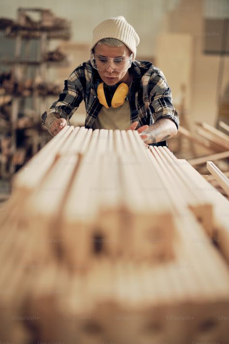 Portrait of strong female carpenter working with wood, stacking and leveling timber in pile photo – Carpenter Image on Unsplash Craftsmanship Photography, Woodworking Photoshoot, Wood Worker Aesthetic, Carpentry Aesthetic, Carpenter Aesthetic, Female Carpenter, Female Carpenter Working, Carpenters Workshop Gallery, Carpenter Work