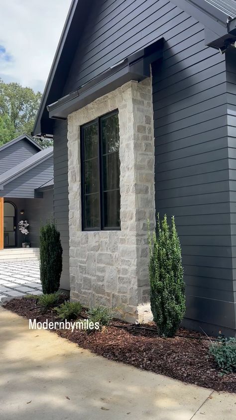 Stone or brick? As you know we are HUGE fans of dark houses. There’s just something about the deep color that adds a level of… | Instagram Dark Siding With Stone Exterior, Dark House With Stone, Limestone And Black House Exterior, Dark Painted Homes Exterior, Dark Siding Light Stone Exterior, Dark Exterior With Light Stone, Black And Stone Exterior, Brick House Remodel, Exterior Rock On House