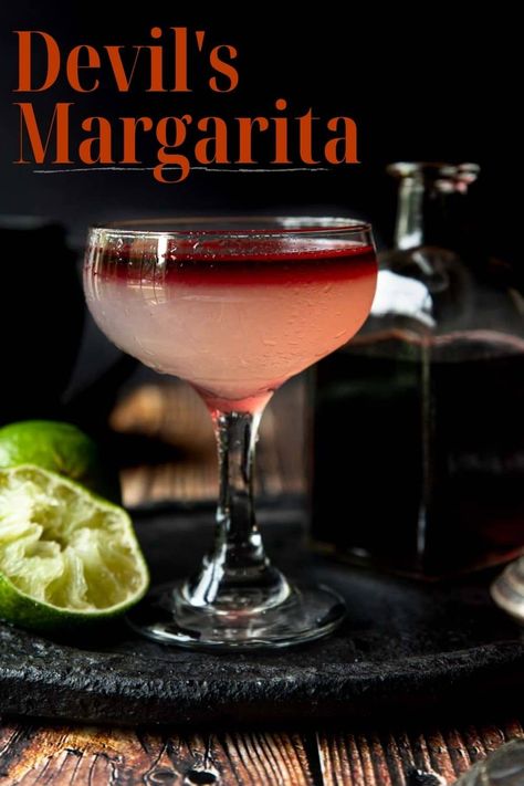 A Devil's Margarita is part lime margarita layered with red wine and is a beautifully spooky cocktail perfect for Halloween season! Red Wine Margarita, Halloween Cocktails Margarita, Margarita Recipes Halloween, Spooky Tequila Cocktails, Halloween Drinks Alcohol Tequila, Spooky Halloween Cocktails, Vampire Margarita, Halloween Drinks Alcohol Recipes, Tequila Halloween Cocktails