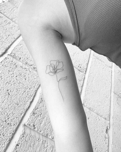 Flower Tattoos One Line, Poppy Elbow Tattoo, Below Inner Elbow Tattoo, Flower Inner Bicep Tattoo, One Line Gladiolus Tattoo, Arms Flowers Tattoo, Small Tattoo On Back Of Arm, Continuous Line Floral Tattoo, Flower Line Tattoo Arm