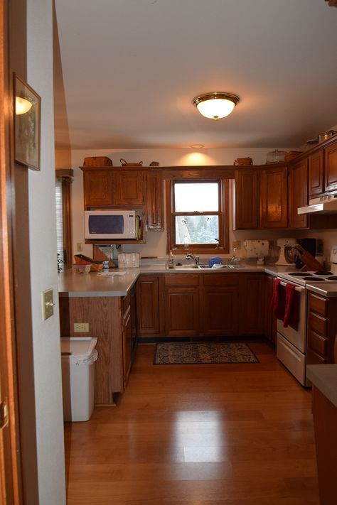 1990's Kitchen Remodel - Edge Construction Company 90s Style Kitchen, 1990 Kitchen, Older Kitchen, 1990s Kitchen, Gold Lighting, Gold Light Fixture, Two Tone Cabinets, Oak Cabinets, Open Concept Kitchen