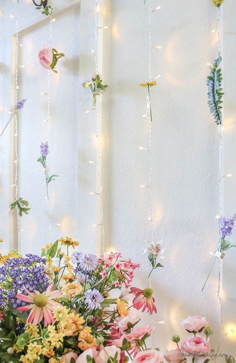 Spring Photobooth Ideas, Home Backdrop Ideas, Backdrop With Flowers And Lights, Spring Party Backdrop, Cute Backdrops, Cute Home Interior, Hanging Flower Wall With Lights, Flower And Lights Backdrop, Outdoor Flower Wall Fence