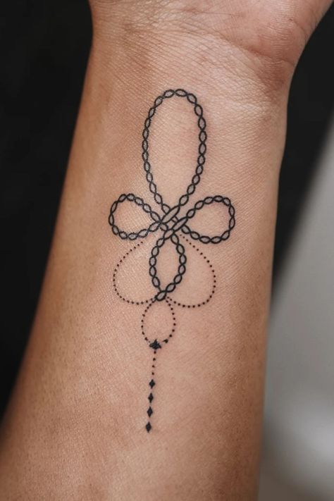 Abstract looped line tattoo with dotted accents on forearm. Feminine Celtic Tattoo For Women, Small Celtic Tattoos For Women, Knot Tattoos, Celtic Tattoo For Women, Tattoo Ideas For Females, Feminine Tattoo Ideas, Bowline Knot, Celtic Knot Tattoo, Reef Knot