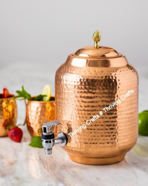 100% Pure Copper Hammered Pure Copper Water Dispenser Pot With Two Glass Water Storage Tank The Copper Dispenser Water Is Anti-Aging. It Helps Reduce Fine Lines, Wrinkles, And Patchy Skin. Drinking Water From Copper Pot Can Thus Help You Look Younger And Fitter.This Dispenser Keeps Skin Healthy and Good for Travelling Purpose Copper is the key component in the production of new cells that help replenish the top layers of your Water Healing, Copper Water Bottle, Copper Utensils, Copper Vessel, Copper Cups, Water Container, Drinking Vessels, Water Containers, Copper Art