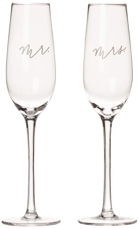 PRICES MAY VARY. Celebrate in Style: Make your wedding toast unforgettable with Pearhead's beautifully scripted "Mr." and "Mrs." champagne flutes. These elegant glasses are perfect for wedding receptions, engagement parties, or anniversary celebrations. Charming Set: This set includes two delicately crafted champagne flutes, one marked "Mr" and the other "Mrs," making it a lovely choice for couples. Ideal Gift: A must-have bridal shower registry item or a thoughtful gift for any bride-to-be. These glasses are designed to complement all wedding themes, from rustic country to sleek city weddings. Cherished Keepsakes: Pair these glasses with your favorite wedding photo to continue reliving your joyous moments long after the wedding, creating a lasting piece of home decor. Product Specificatio Amazon Wedding Decor, Toasting Glasses Wedding, Bridal Shower Registry, Wedding Toasting Glasses, Toasting Flutes Wedding, Wedding Champagne Glasses, Glasses Wedding, Wedding Champagne, Champagne Flute Set