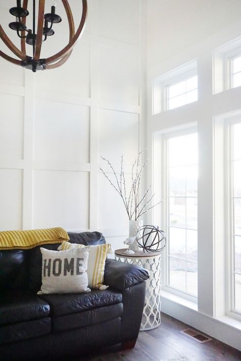 Living room paneling ideas. Living room paneling ideas. We decided on a beautiful and simple white square board and batten for this room because I just felt it was a little more formal but also very simple and clean. Living room paneling ideas. Living room paneling ideas #Livingroompaneling #Livingroompanelingideas Home Bunch's Beautiful Homes of Instagram Panel Wall With Windows, Board And Batten Wall High Ceiling, Board And Batten High Ceiling, Wall Paneling Hallway, Square Wall Paneling, Paneling Hallway, Hallway Board And Batten, Room Paneling, Wall Paneling Ideas Living Room