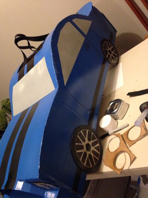 Cardboard Mustang Car Halloween Costume Car Cardboard Box Ideas, Car Costume For Kids, Diy Car Costume, Diy Cardboard Car Costume, Surprise Auto, Cardboard Car Costume, Cardboard Box Race Car Diy, Car Costume Diy Cardboard Boxes, Diy Cardboard Car