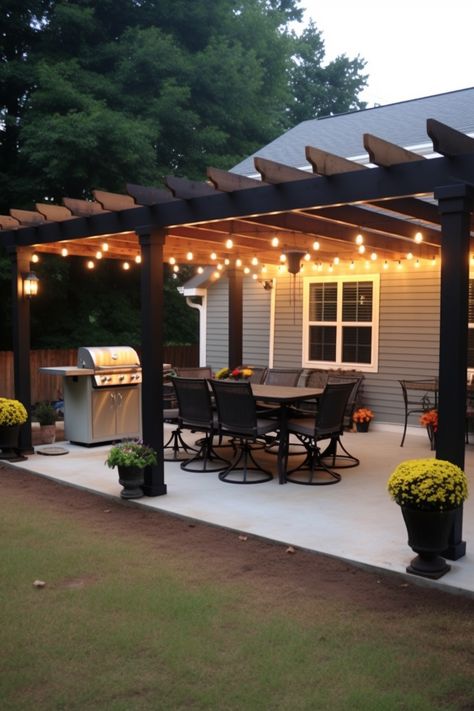 Transform your patio into an inviting outdoor dining space with a stylish pergola. Embrace high contrast lighting and a dark gray and black color scheme for a touch of industrial, cabincore charm. Enjoy meals in the serene ambiance of the southern countryside. Diy Covered Patio, Backyard Lights, Black Pergola, Diy Patio Cover, High Contrast Lighting, Yard Oasis, Outdoor Patio Ideas Backyards, Bloxburg Building, Pathway Landscaping