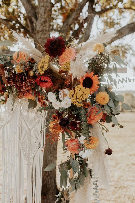 August Boho Wedding, July Boho Wedding, Boho Fall Wedding With Sunflowers, Fall Boho Wedding Flowers Arch, Moongate Arch Wedding, Boho Sunflower Wedding, Fall Leaves Wedding Arch, Orange Boho Bouquet, Moongate Arch