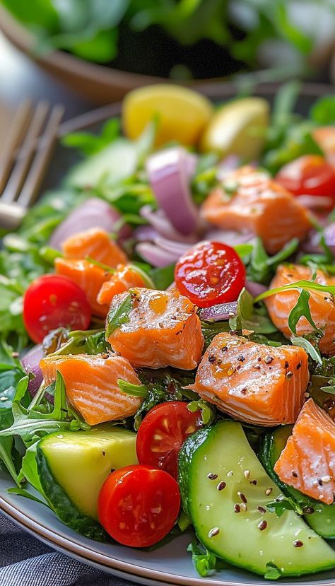 This Fresh and Healthy Salmon Salad Recipe is the perfect meal for anyone looking for a light, nutritious, and satisfying dish. Made with perfectly grilled or baked salmon, fresh greens, and a zesty lemon vinaigrette, this salad is bursting with flavor and packed with omega-3s. Add your favorite vegetables like cucumber, avocado, and cherry tomatoes for extra crunch and color. Cucumber And Salmon Salad, Salmon Salad Recipe, Salmon Salad Recipes, Salmon Spinach, Green Salad Recipes, Cucumber Avocado, Healthy Salmon, Seared Salmon, Lemon Vinaigrette