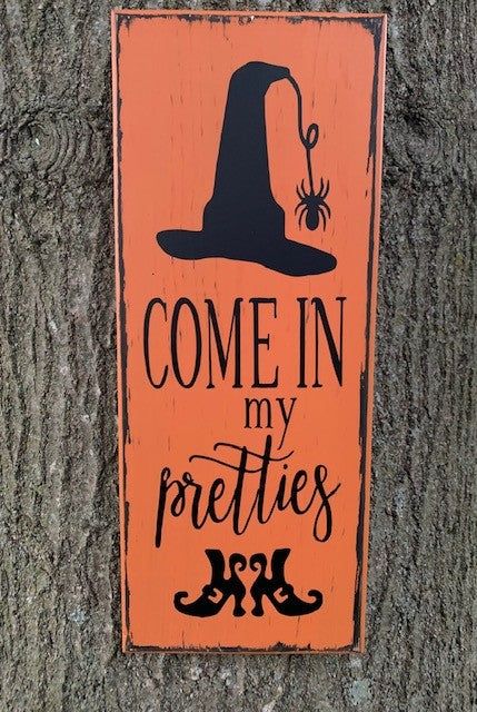 Bring a touch of old-world charm and simplicity into your home with this distressed Halloween witch sign. Perfect for fall decorations, the wooden sign will inspire memories of simpler times and add a touch of rustic elegance. Come in and experience the magic for yourself, my pretties! Approx. Measurement: 24" X 7"x .75"Materials: Wood Pine Board, Primer, Outdoor Black and Orange Paint Distressed, Black Outdoor Vinyl Lettering, Saw Tooth HangerThis sign has been primed, exterior paint in black p Wooden Halloween Signs, Primitive Halloween Decor, Come In, Halloween Chalkboard, Witch Signs, Halloween Front Doors, Halloween Porch Decorations, Primitive Fall, Primitive Halloween