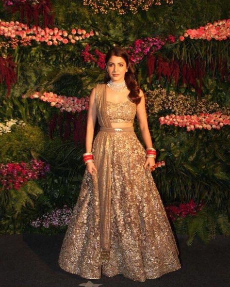 50 best pictures from Anushka Sharma and Virat Kohli’s Mumbai reception Golden Lehenga Brides, Golden Bridal Lehenga, भारतीय दुल्हन संबंधी, Golden Lehenga, डिजाइनर कपड़े, Mumbai Wedding, Reception Outfit, Sabyasachi Lehenga, Wedding Lehenga Designs