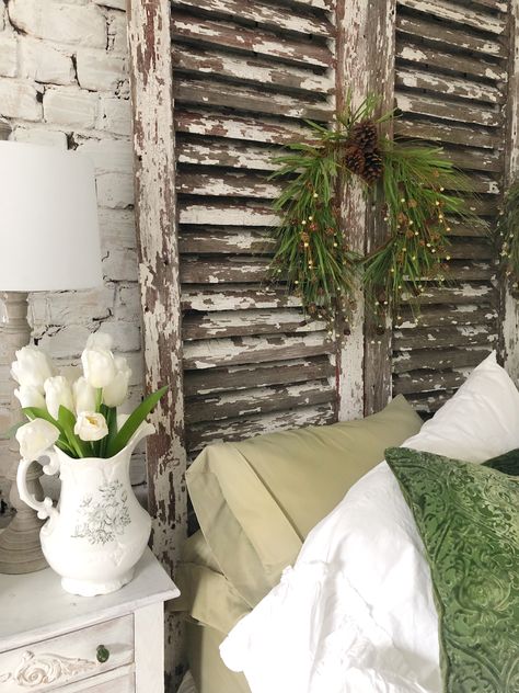 How we made our antique shutter headboard and decorated it, too! Old Louvered Door Ideas Repurposed, Louvered Door Ideas Repurposed, Window Headboard Ideas, Shutter Headboard Ideas, Shutters Wall Decor, Old Window Headboard, Old Shutters Decor, Shutters Bedroom, Shutter Headboard