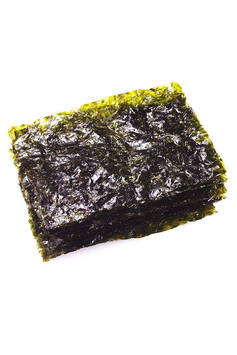 toasted nori wraps: craving something salty? skip chips & have toasted nori instead; sea vegetable used in sushi & has that "I want more" umami flavor; is also richest dietary source of iodine, which helps to activate thyroid hormone so that food is converted to energy versus fat Nori Wraps, Nori Wrap, Nori Sheets, Energy Boosting Snacks, Weird Snacks, Chicken Paella, Seaweed Snacks, Paella Recipe, Sea Vegetables