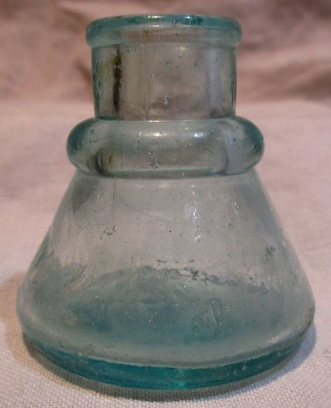 "Don't you just love old ink bottles like these? They are so evocative of a more romantic time, when people took time to write letters, by hand, in cursive! Plus little bottles like these are really useful as bud vases. This one is quite old and features old wavy glass with some bubbles in the glass. The glass is a light blue / aqua / teal color. The bottle is in unusual and totally unique condition, as it looks like the glass blower had one side soften and \"dent\" so what you see in the close Vintage Calligraphy, Writing Materials, Old Glass Bottles, Calligraphy Writing, Teal Glass, Antique Glass Bottles, Write Letters, Ink Bottle, Paper Pencil