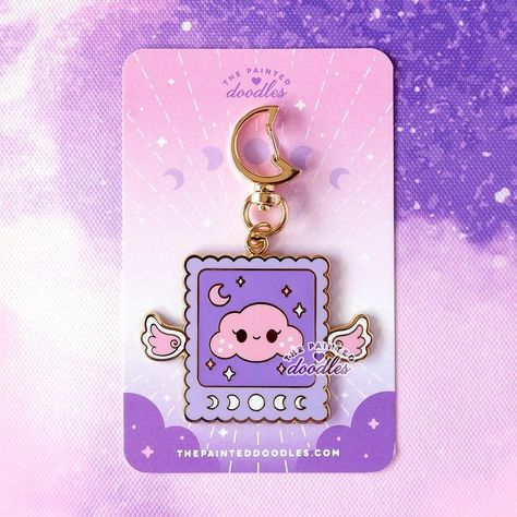 ✨Special discount on the celestial collection!✨ ☁️Fluffy Cloudy enamel keychain💜 . . . #accessories #gift #charm #keychains #kawaii… | Instagram Keychain Packaging Design, Omamori Design, Keychain Package, Keychain Packaging, Kawaii Instagram, Charm Keychains, Sticker Packaging, Vendor Table, Enamel Keychain