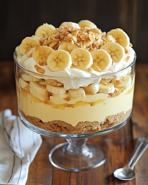 "This is my go-to recipe for Banana Pudding Trifle! It’s always a crowd-pleaser and brings back so many sweet memories.  Ingredients: - Ripe bananas - Vanilla pudding - Whipped cream - For additional ingredients, Link in first comment [👇] [👇]  This dessert is creamy, dreamy, and oh-so-delicious! Perfect for parties or just a sweet treat at home.   #BananaPudding #Trifle #DessertRecipe #Yummy #SweetTreat" Vanilla Pudding Trifle, Banana Pudding Aesthetic, Pudding Aesthetic, Recipe For Banana Pudding, Peanut Butter Banana Recipes, Banana Trifle, Pudding Trifle, Banana Pudding Trifle, Banana Pudding Cupcakes