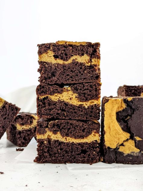 Pumpkin Protein Brownies with a protein pumpkin swirl; Healthy, low calorie and rich in chocolate and pumpkin spice flavor! Cocoa powder but no chocolate! Pumpkin Cheesecake Swirl, Protein Powder Brownies, Pumpkin Swirl Brownies, Low Calorie Pumpkin, Almond Milk Cheese, Cocoa Powder Brownies, Low Cal Dessert, Unflavored Protein Powder, Pumpkin Protein