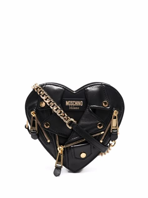 Black/gold leather Heart Biker leather crossbody bag from MOSCHINO featuring logo patch to the front, decorative zip detailing, gold-tone hardware, chain-link shoulder strap, top zip fastening and main compartment. | Moschino Heart Biker leather crossbody bag Moschino Biker Bag, Moschino Bag Handbags, Edgy Bags, Biker Chain, Moschino Bag, Moschino Bags, Leather Heart, Crossbody Bag Black, Girly Bags